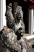 Bangkok Wat Arun - the gallery is lined all around with beautiful statues of chinese figures. 